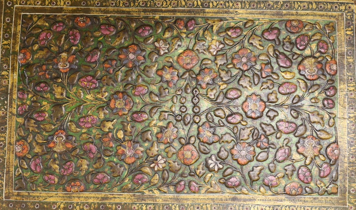 A Persian embossed and painted rectangular plaque, 42.5 cms wide x 62 cms high.